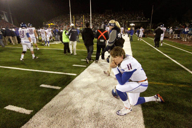 Boise State Broncos quarterback Kellen Moore on the sidelines after losing to Nevada 34-31 Friday night, Nov. 26, 2010, in Reno.