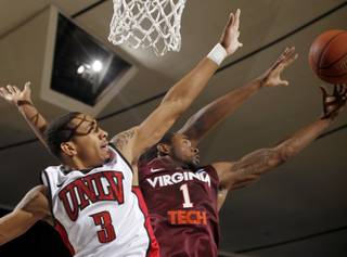 UNLV guard Anthony Marshall, left, and Virginia Tech guard Terrell Bell vie for a rebound at the 76 Classic in Anaheim, Calif., Sunday, Nov. 28, 2010.