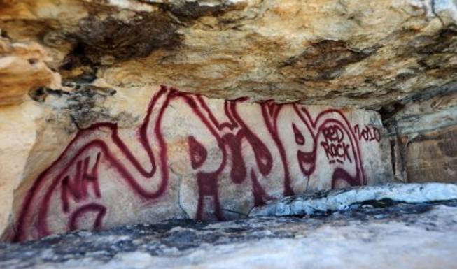 Damage is shown after vandals used spray paint on historic rock art panels at Red Rock Canyon. 