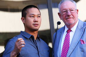 Zappos CEO Tony Hsieh and Las Vegas Mayor Oscar Goodman answer questions Wednesday, Dec. 1, 2010, at the Las Vegas City Council meeting, when it was officially announced the existing City Hall building would be used as the corporate headquarters for online retailer Zappos.com.