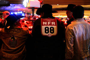 Cowboys belly up to the bar during an after-party at The Mirage sports book following the first go-round of the National Finals Rodeo on Thursday, Dec. 2, 2010.