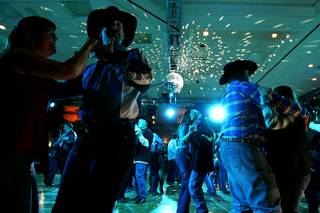 Rodeo fans dance at the Gold Coast's Buck AoN Ball Sunday, December 5, 2010.
