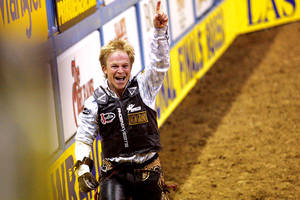 Eventual bareback winner Wes Stevenson celebrates after a wild ride on Nutrena's Wise Guy during Round 6 of the National Finals Rodeo on Tuesday, Dec. 7, 2010, at the Thomas & Mack.