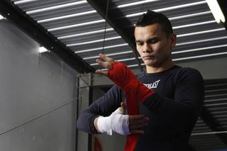 Super lightweight boxer Marcos Maidana of Argentina wraps his hands before a workout in Las Vegas, Wednesday, December 8, 2010. Maidana will take on Amir Khan of England in a WBA super lightweight title fight at the Mandalay Bay Events Center on Saturday.