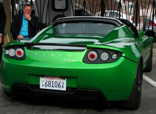 Las Vegas City Councilman Steve Ross looks over an all-electric Tesla Roadster Sport that was brought by Tesla Motors to the opening of the solar carports at the Stupak Community Center, 521 Bonanza, Dec. 9, 2010.