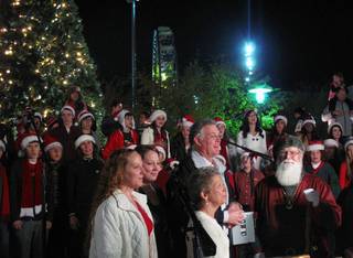 Santa Claus, Henderson Mayor Andy Hafen and his family celebrate during the Winterfest tree-lighting ceremony Friday night. Hundreds were in attendance at the Henderson Events Plaza and Convention Center, 200 S. Water St., to celebrate the holiday season.