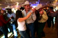 Rodeo fans dance during the NFR World Champion Awards Show and After Party at the Mirage Saturday, December 11, 2010.