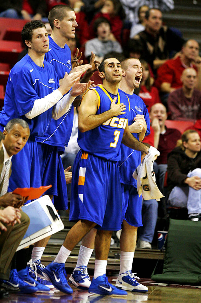 The UC Santa Barbara bench celebrates another three point basket during their game against UNLV Wednesday, December 15, 2010 at the Thomas & Mack Center. UCSB won the game 68-62