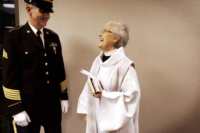 Reverend Mary Bredlau chats with bugler Sgt. Richard Dalton of the Nevada Honor Guard before a funeral at Palm Mortuary on Easter and Warm Springs in Las Vegas December 22, 2010.