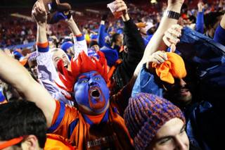 Boise State fans celebrate after their team beat Utah 26-3 to win the Maaco Bowl Las Vegas Wednesday, December 22, 2010 at Sam Boyd Stadium in Las Vegas.