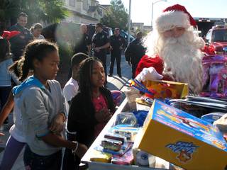 The North Las Vegas Fire Department delivered toys Friday morning to the McJoy family as a part of its Emergency Holiday Cheer program.