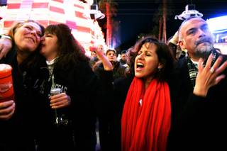 Lorann Watts, from left, and Elma Calderon of Milwaukee and Martha Picemo and Al Picemo of Temecula, Calif., enjoy Heart Alive, a Heart tribute band, during New Year's Eve Tribute Palooza at the Fremont Street Experience in downtown Las Vegas on Friday, Dec. 31, 2010.