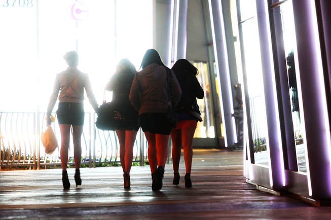A group of women walk past the Cosmopolitan on the Las Vegas Strip on New Year's Eve 2010.