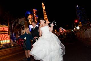A newlywed couple heads down the Strip to celebrate their marriage on New Year's Eve 2010.