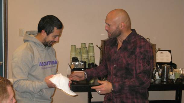 Verifiable badass Randy Couture meets with a fan in the media center at UFC 125 at MGM Grand Garden Arena.