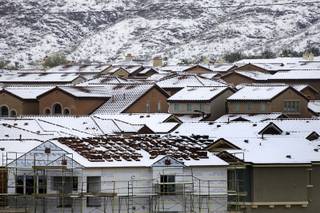 Snow covers rooftops in Summerlin on Monday, January 3, 2011. 