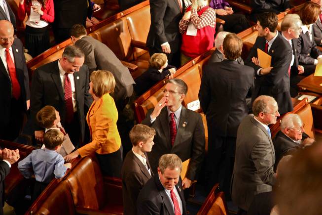 Rep. Joe Heck blows a kiss to his wife in the House gallery after taking his oath on Wednesday, Jan. 5, 2011. 