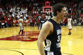 BYU's Jimmer Fredette celebrates after dropping 39 on UNLV in the Thomas & Mack Center on Wednesday, Jan. 5, 2011.  BYU won the game 89-77.