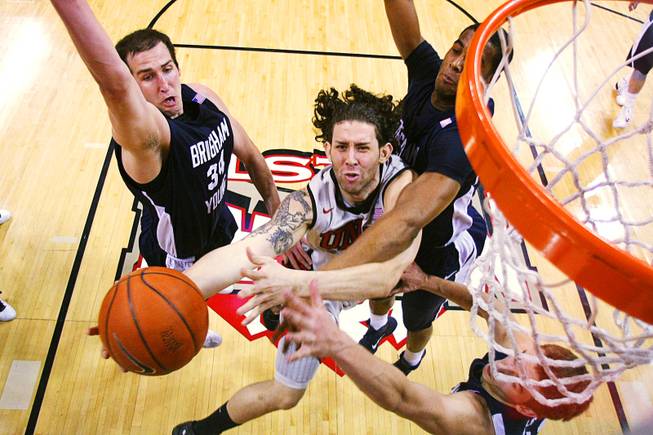 UNLV's Carlos Lopez puts up two points against BYU during the second half of their game Wednesday, January 5, 2011. BYU won the conference opener for both teams 89-77.