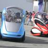 The Xiao, left, and Jiao, right, EN-V models from General Motors take a test run at the Consumer Electronics Show on Friday afternoon.