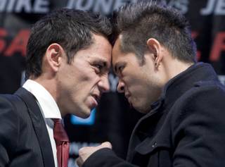 WBC/WBO bantamweight champion Fernando Montiel, left, of Mexico and Nonito Donaire of the Philippines face off during a news conference at the Mandalay Monday, January 10, 2011. Montiel will defend his titles against Donaire at the Mandalay Bay Events Center on February 19.
