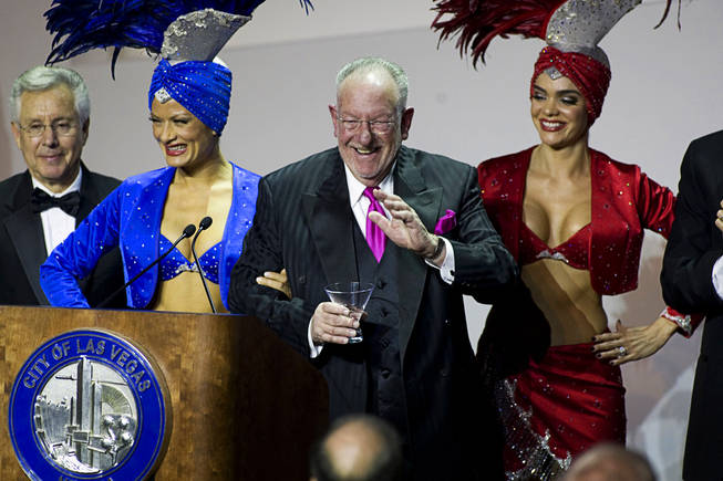 Las Vegas Mayor Oscar Goodman waves before leaving the stage with showgirls after delivering the annual State of the City address at the Cleveland Clinic Lou Ruvo Center for Brain Health in downtown Las Vegas on Tuesday, Jan. 11, 2011.