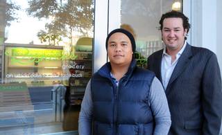 Grant Garcia, 32, and Sam Cherry, 32, stand in front of Resnicks Grocery store downtown on Wednesday, Jan. 12, 2011. Garcia, Cherry and Mike Goldstein, not pictured, are partners of Cherry Development, which owns and manages the new 