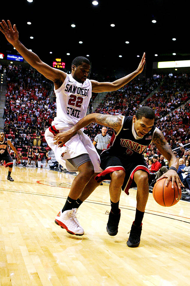 San Diego State's Chase Tapley and UNLV's Anthony Marshall