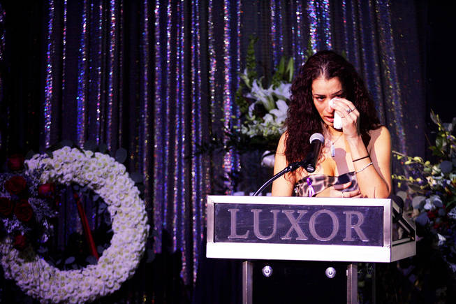 Celeste Flores Narvaez, Debora's sister, speaks during a memorial service for Debora Flores Narvaez at the Atrium Showroom at Luxor Friday, January 14, 2011. 