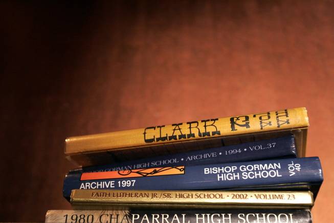 Old Las Vegas yearbooks are shown stacked inside Born and Raised Tavern.