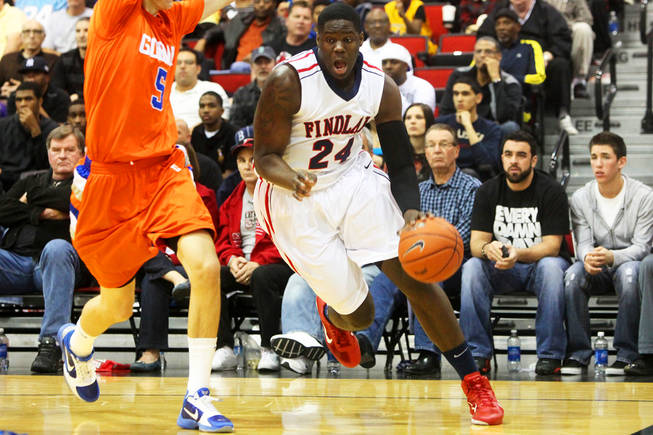 Findlay Prep's Anthony Bennett drives past Bishop Gorman's Rosco Allen during a game Saturday, Jan. 22, 2011, at the Cox Pavilion. Findlay left with an 89-86 double-overtime victory.
