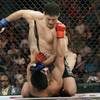 Strikeforce welterweight champion Nick Diaz administers a ground and pound attack on K.J. Noons in a title fight last September. Diaz won a unanimous decision and next defends his belt Saturday against Evangelista 'Cyborg' Santos.