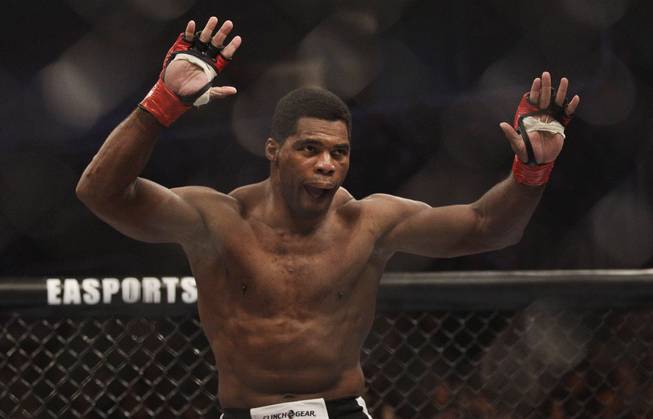 Former NFL football player Herschel Walker prepares to fight Scott Carson in the first round of a Strikeforce heavyweight mixed martial arts fight in San Jose, Calif., Saturday, Jan. 29, 2011. Walker won by technical knock out in the first round.