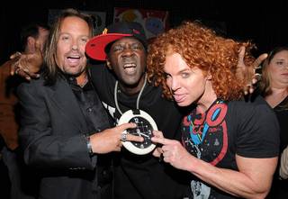 Vince Neil celebrates his 50th birthday at Blush nightclub with his girlfriend Alicia Jacobs, Carrot Top, and Flavor Flav on Feb. 5, 2011.