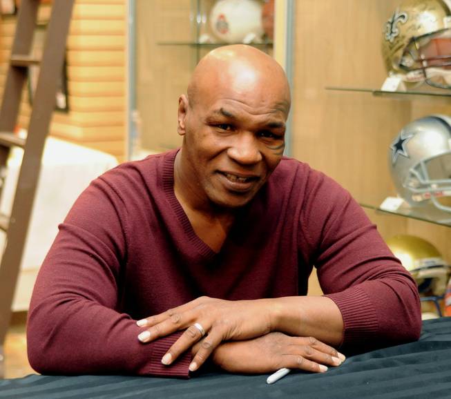 Mike Tyson signs autographs at Miracle Mile Shops at Planet Hollywood on Feb. 4, 2011.