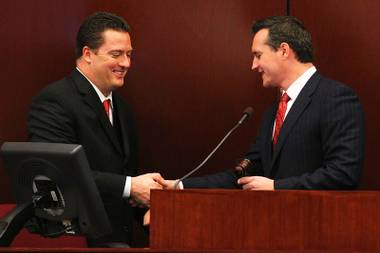 Secretary of State Ross Miller shakes Assemblyman John Oceguera’s hand while handing him the gavel after Oceguera was named Assembly Speaker during the first day of the 2011 legislative session Monday, February 7, 2011 in Carson City.