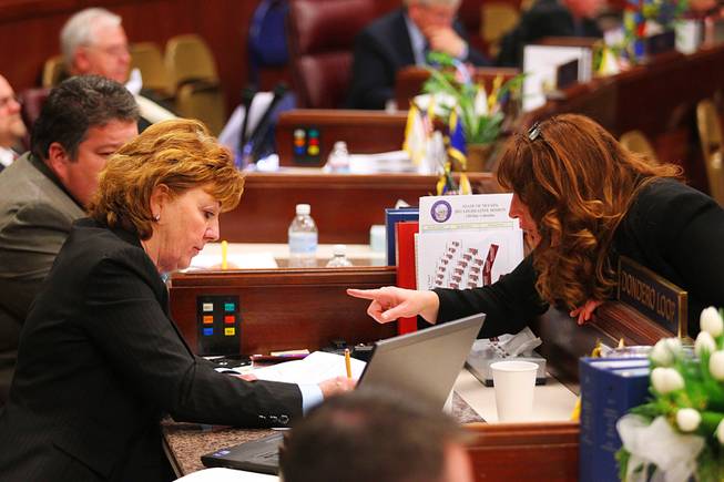 Assemblywoman Marilyn Kirkpatrick talks to Assemblywoman Marilyn Dondero Loop during the first day of the 2011 legislative session Monday, February 7, 2011 in Carson City.