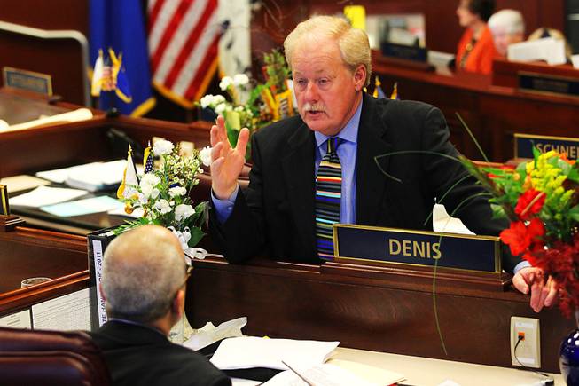 Senator Michael Schneider speaks to Senator Mo Denis during the first day of the 2011 legislative session Monday, February 7, 2011 in Carson City.