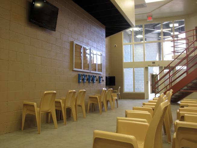 A TV area in a housing unit leads directly out to the recreation area as part of the self-containment design. 