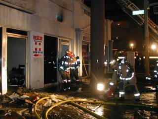 Las Vegas Fire and Rescue crews battle a blaze at a building housing four businesses at the corner of Bonneville Avenue and Las Vegas Boulevard. Crews responded at 2:20 a.m. Wednesday. No one was injured, but the building sustained extensive damage.