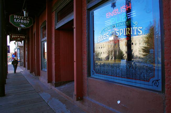 The Legislative Building is reflected in the window of a bar and restaurant across the street on the fifth day of the 2011 legislative session Friday, February 11, 2011 in Carson City.