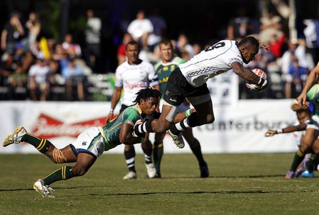 Branco du Preez (#10) of South Africa tackles Mitieli Nacagilevu (#8) of Fiji during the final match of the 2011 USA Sevens Rugby World Series at Sam Boyd Stadium Sunday, February 13, 2011. South Africa beat Fiji for the championship 24-14.