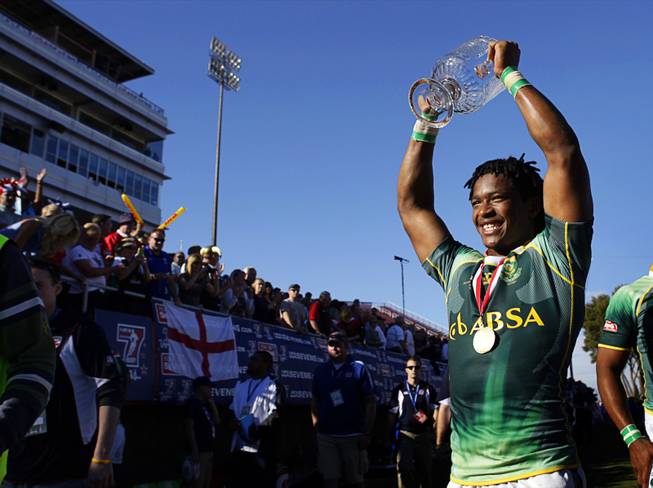 Branco du Preez of South Africa holds up the trophy after beating Fiji in the final match of the 2011 USA Sevens Rugby World Series at Sam Boyd Stadium Sunday, February 13, 2011.