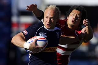 Marco Barnard (#2) of the USA carries the ball in a game against Japan during the 2011 USA Sevens Rugby World Series at Sam Boyd Stadium Sunday, February 13, 2011. The USA team won a 27-7  victory over Uruguay, then beat Japan 19-12 to win the Shield final.