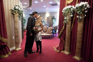 Christopher Pruett, left, and Cindy Zuniga of Honolulu, Hawaii, kiss after being pronounced man and wife at the Little White Wedding Chapel, Monday, Feb. 14, 2011 in Las Vegas. 