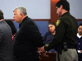 Bob Gilbert, the former construction chief at the College of Southern Nevada, is led away after sentencing at the Regional Justice Center Wednesday, Feb. 16, 2011.