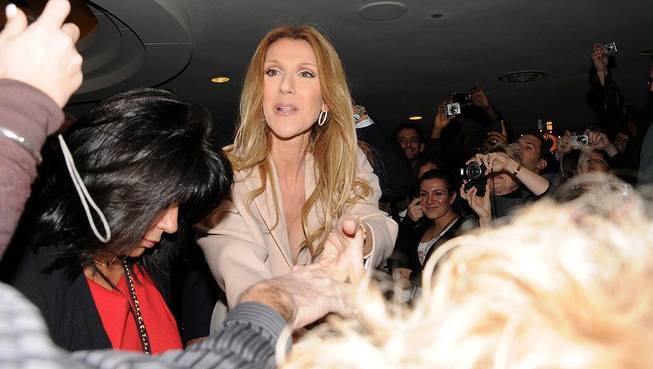 Celine Dion, with husband Rene Angelil, son Rene-Charles and twin boys Eddy and Nelson, arrives at Caesars Palace on Feb. 16, 2011.