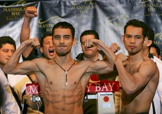 WBC/WBO bantamweight champion Fernando Montiel of Mexico and Nonito Donaire of the Philippines pose during an official weigh-in Friday at Mandalay Bay. Montiel will defend his titles against Donaire at the Mandalay Bay Events Center on Saturday.