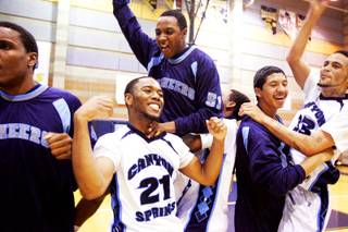 Canyon Springs celebrates their win over Eldorado for the Sunrise Regional boys basketball championships at Foothill High School in Henderson Friday, February 18, 2011.