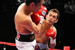 Nonito Donaire of the Philippines (R) punches at WBC/WBO bantamweight champion Fernando Montiel of Mexico during their title fight Saturday at the Mandalay Bay Events Center.